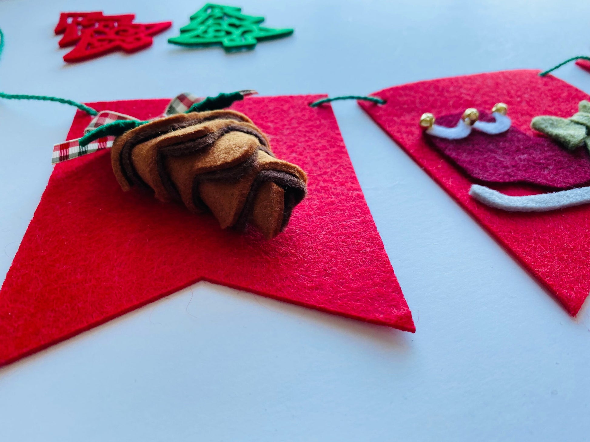 Christmas Flag Bunting with Pennants featuring Mistletoe, Candy Canes, Sleigh, Candle with Lantern, and Pinecone