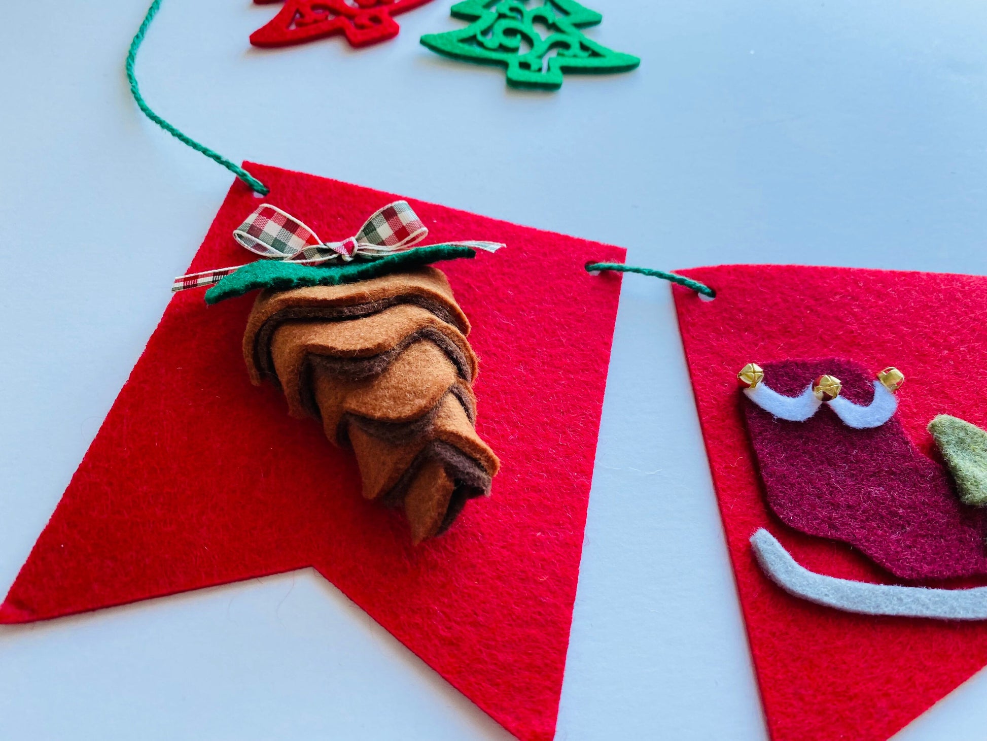 Christmas Flag Bunting with Pennants featuring Mistletoe, Candy Canes, Sleigh, Candle with Lantern, and Pinecone