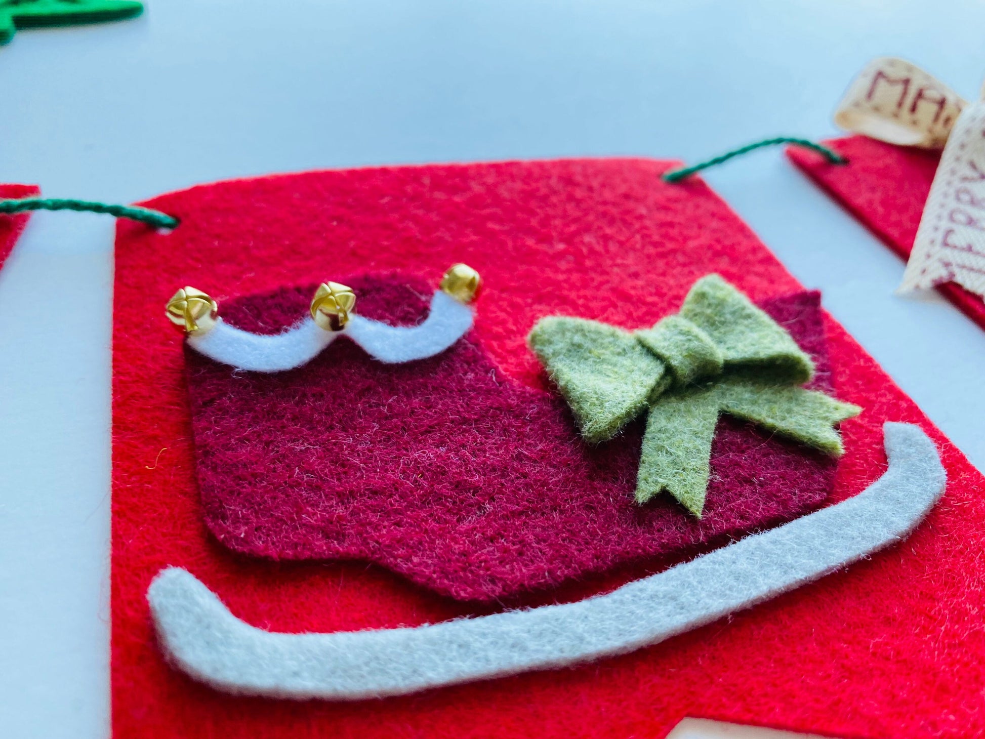 Christmas Flag Bunting with Pennants featuring Mistletoe, Candy Canes, Sleigh, Candle with Lantern, and Pinecone