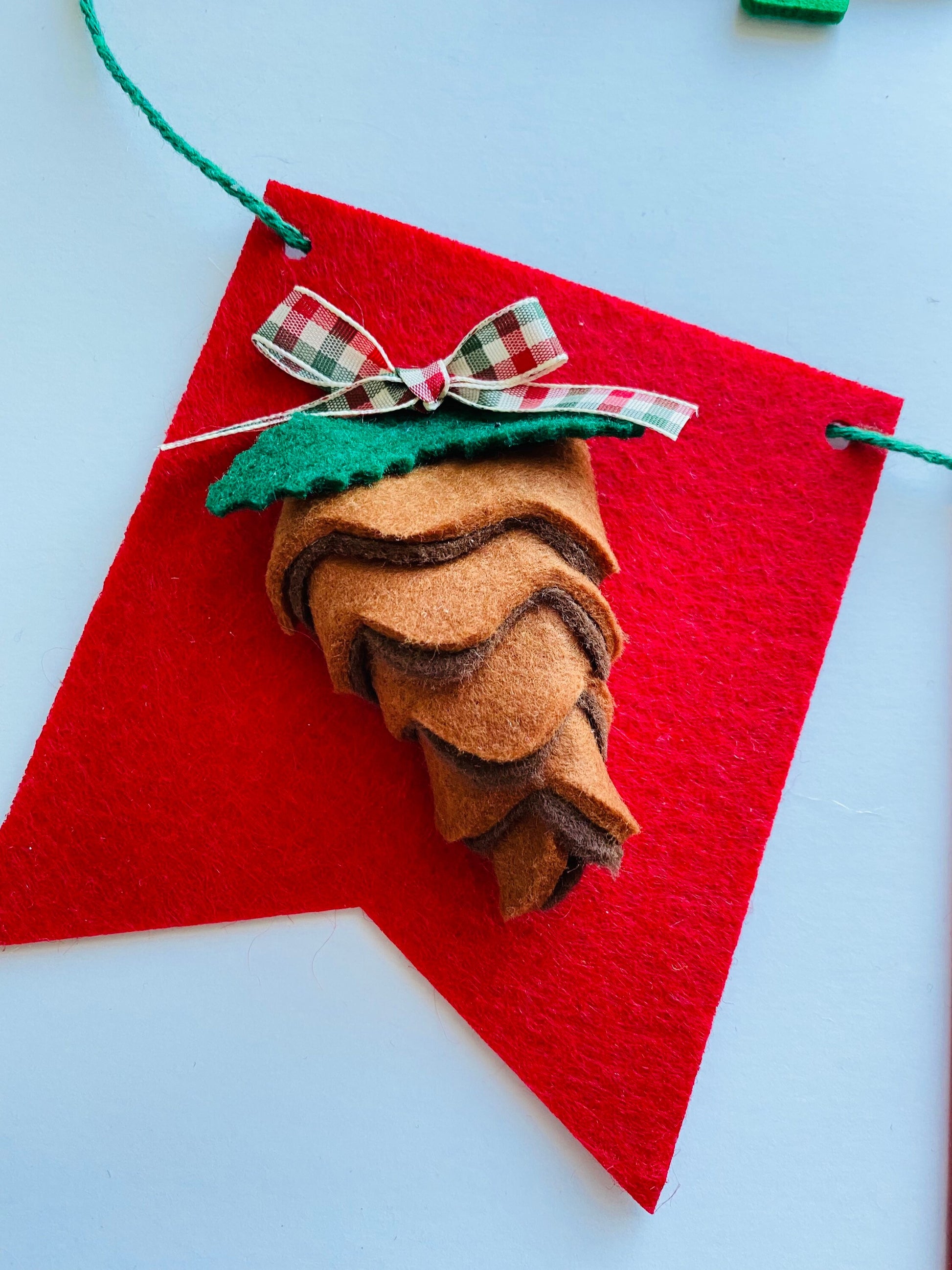 Christmas Flag Bunting with Pennants featuring Mistletoe, Candy Canes, Sleigh, Candle with Lantern, and Pinecone