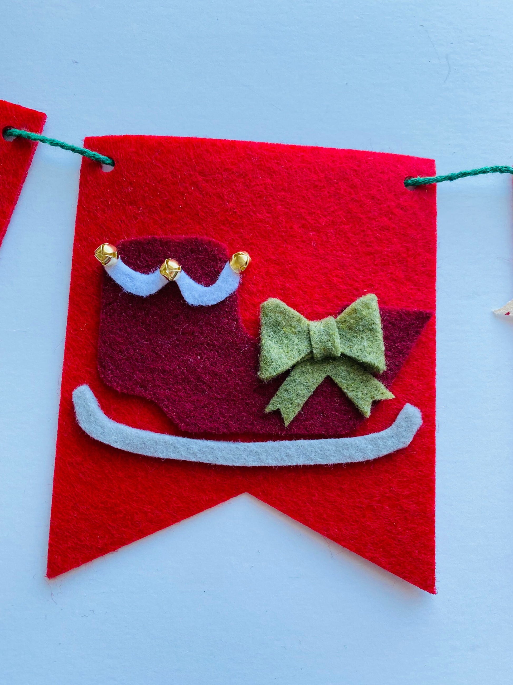 Christmas Flag Bunting with Pennants featuring Mistletoe, Candy Canes, Sleigh, Candle with Lantern, and Pinecone
