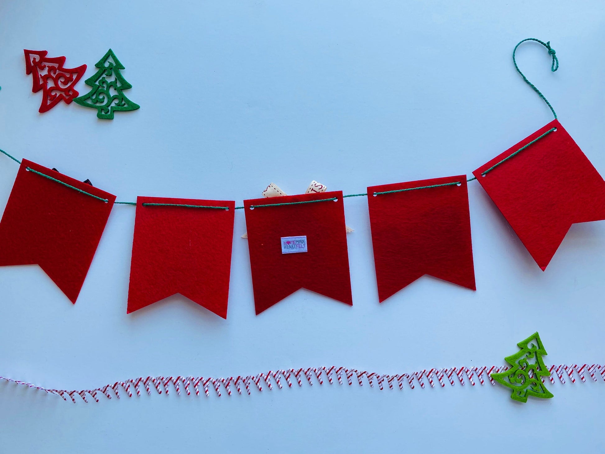 Christmas Flag Bunting with Pennants featuring Mistletoe, Candy Canes, Sleigh, Candle with Lantern, and Pinecone