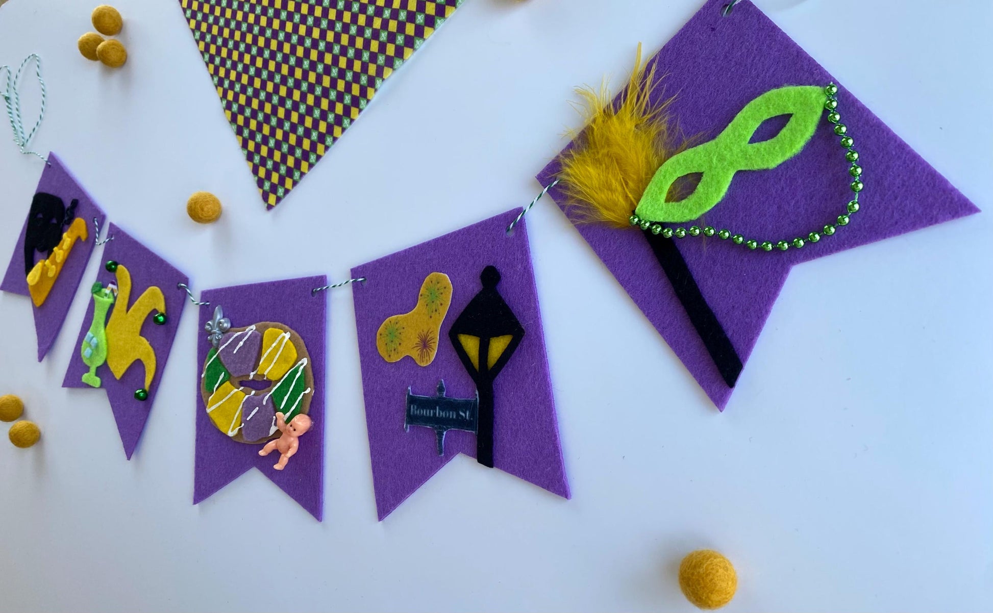 Mardi Gras Flag Bunting with Pennants featuring Bourbon St, King Cake, Masks, Fleur de Lis, Drinks, Beads, and Saxophone