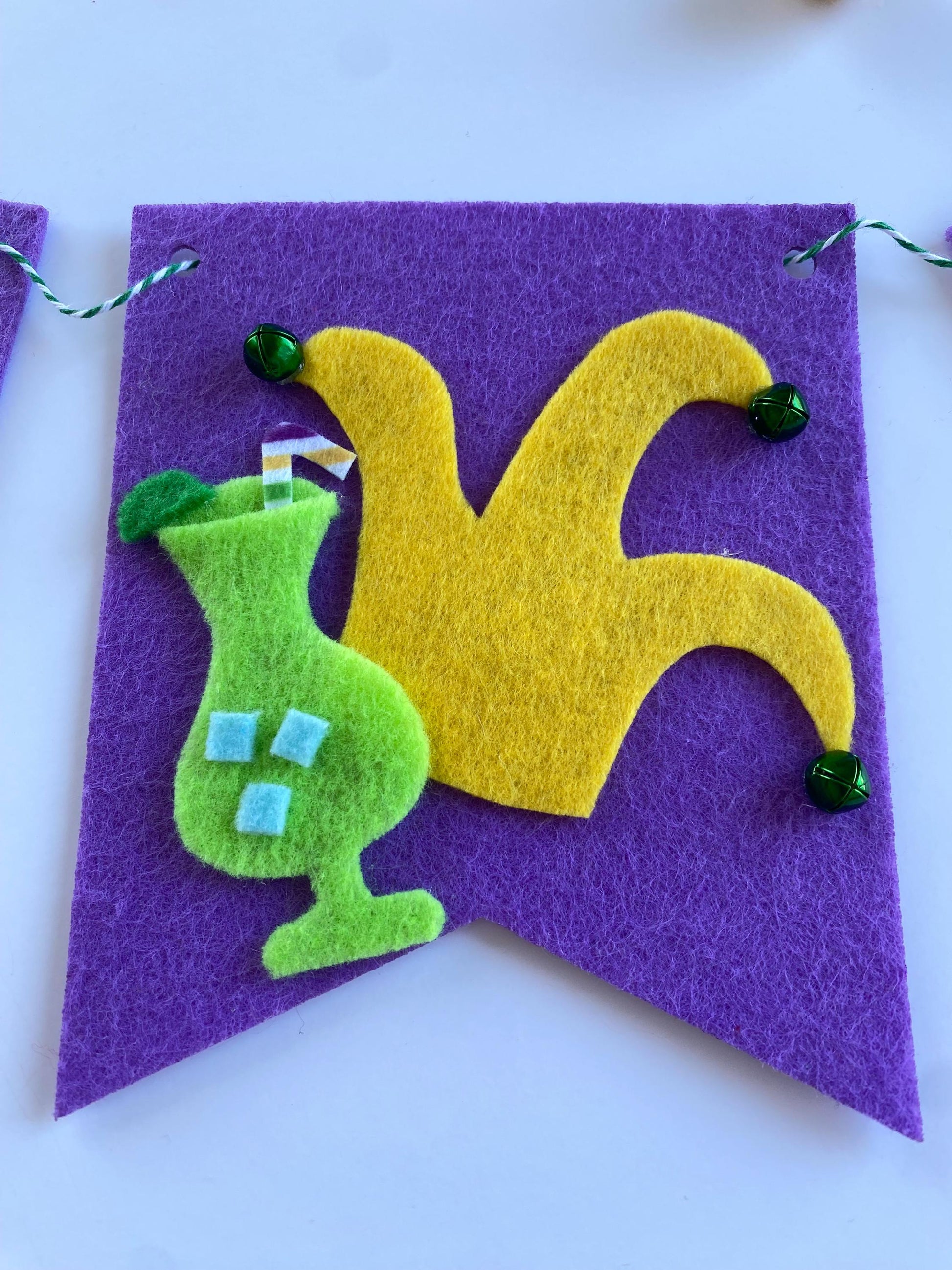 Mardi Gras Flag Bunting with Pennants featuring Bourbon St, King Cake, Masks, Fleur de Lis, Drinks, Beads, and Saxophone