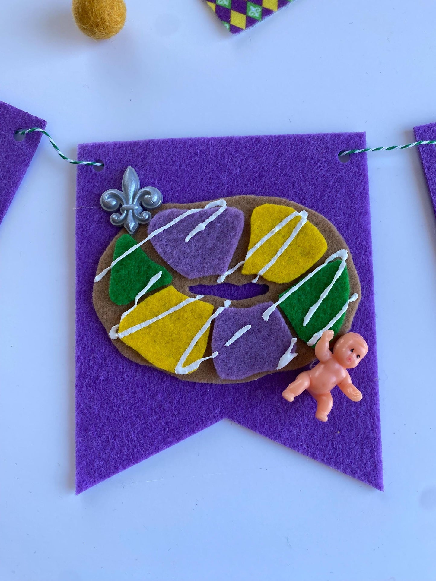 Mardi Gras Flag Bunting with Pennants featuring Bourbon St, King Cake, Masks, Fleur de Lis, Drinks, Beads, and Saxophone