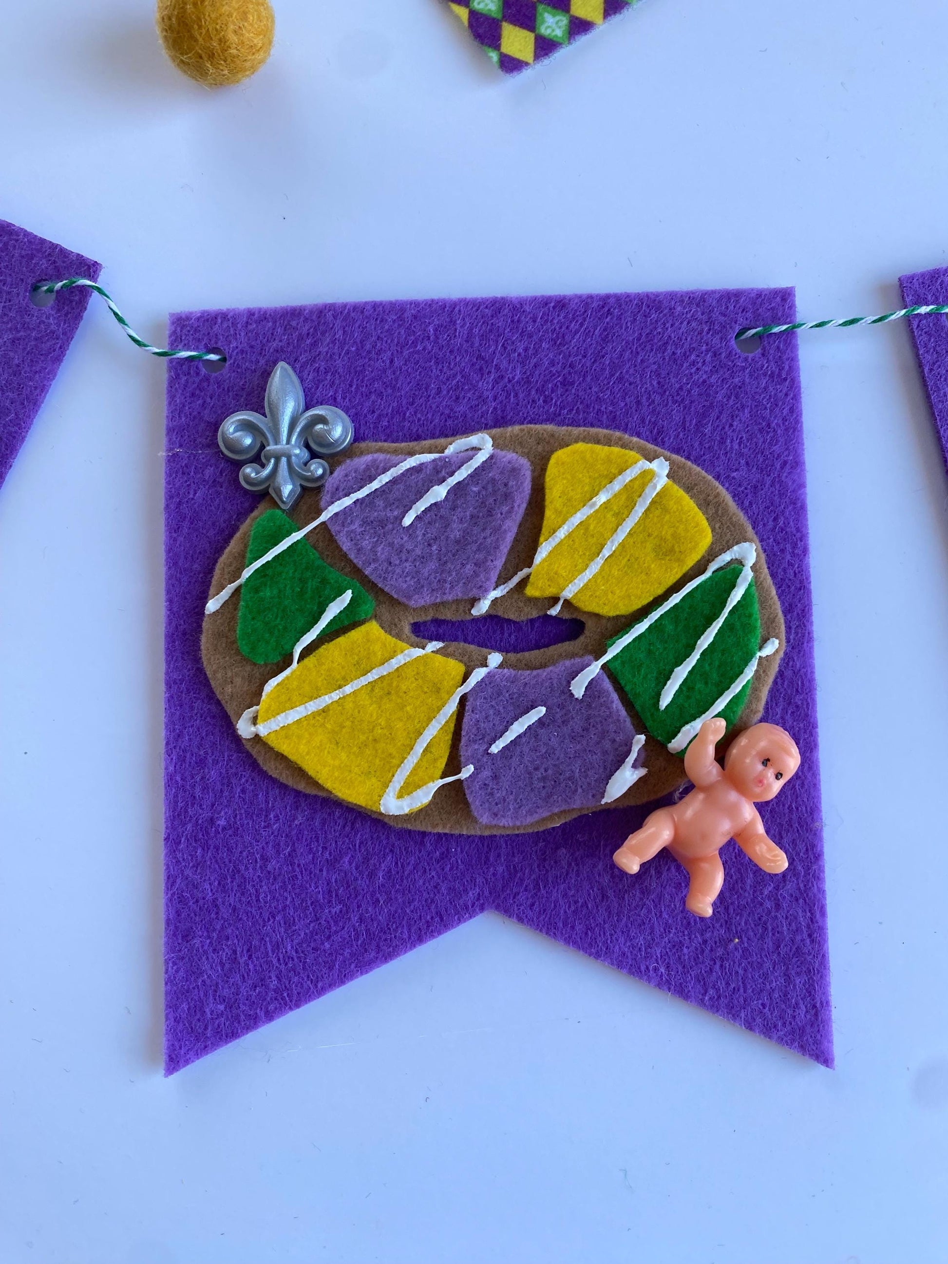 Mardi Gras Flag Bunting with Pennants featuring Bourbon St, King Cake, Masks, Fleur de Lis, Drinks, Beads, and Saxophone