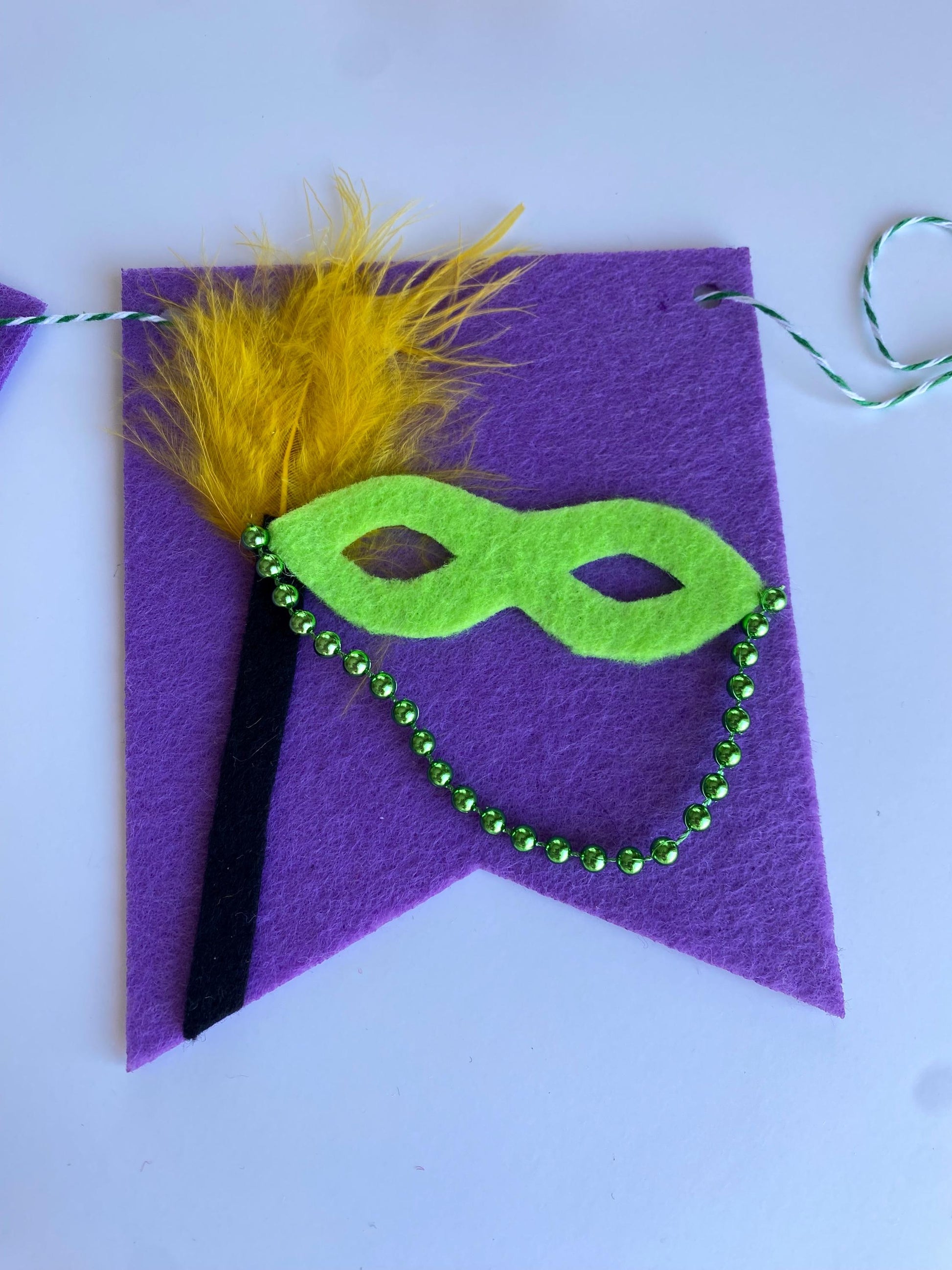 Mardi Gras Flag Bunting with Pennants featuring Bourbon St, King Cake, Masks, Fleur de Lis, Drinks, Beads, and Saxophone