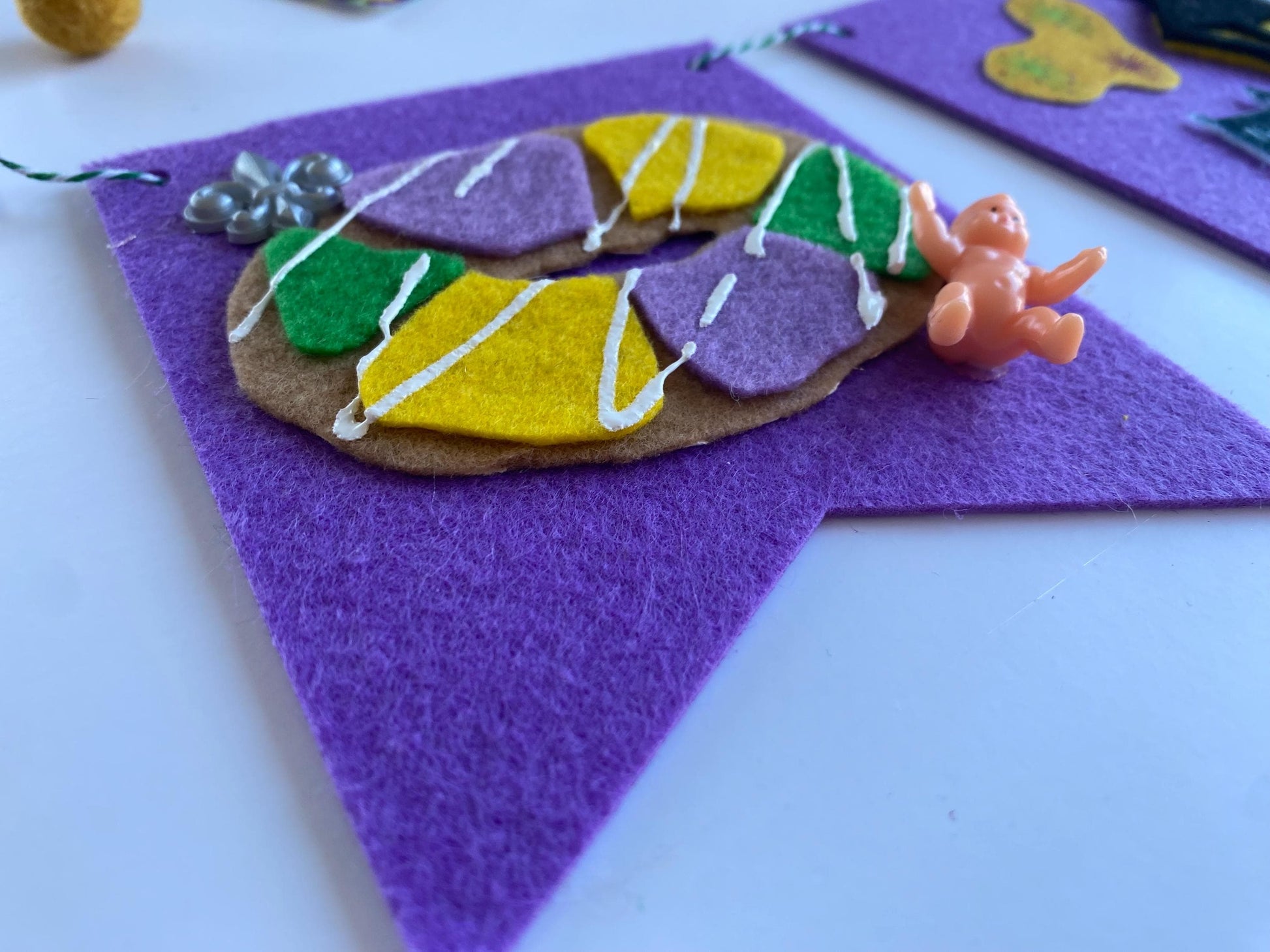 Mardi Gras Flag Bunting with Pennants featuring Bourbon St, King Cake, Masks, Fleur de Lis, Drinks, Beads, and Saxophone