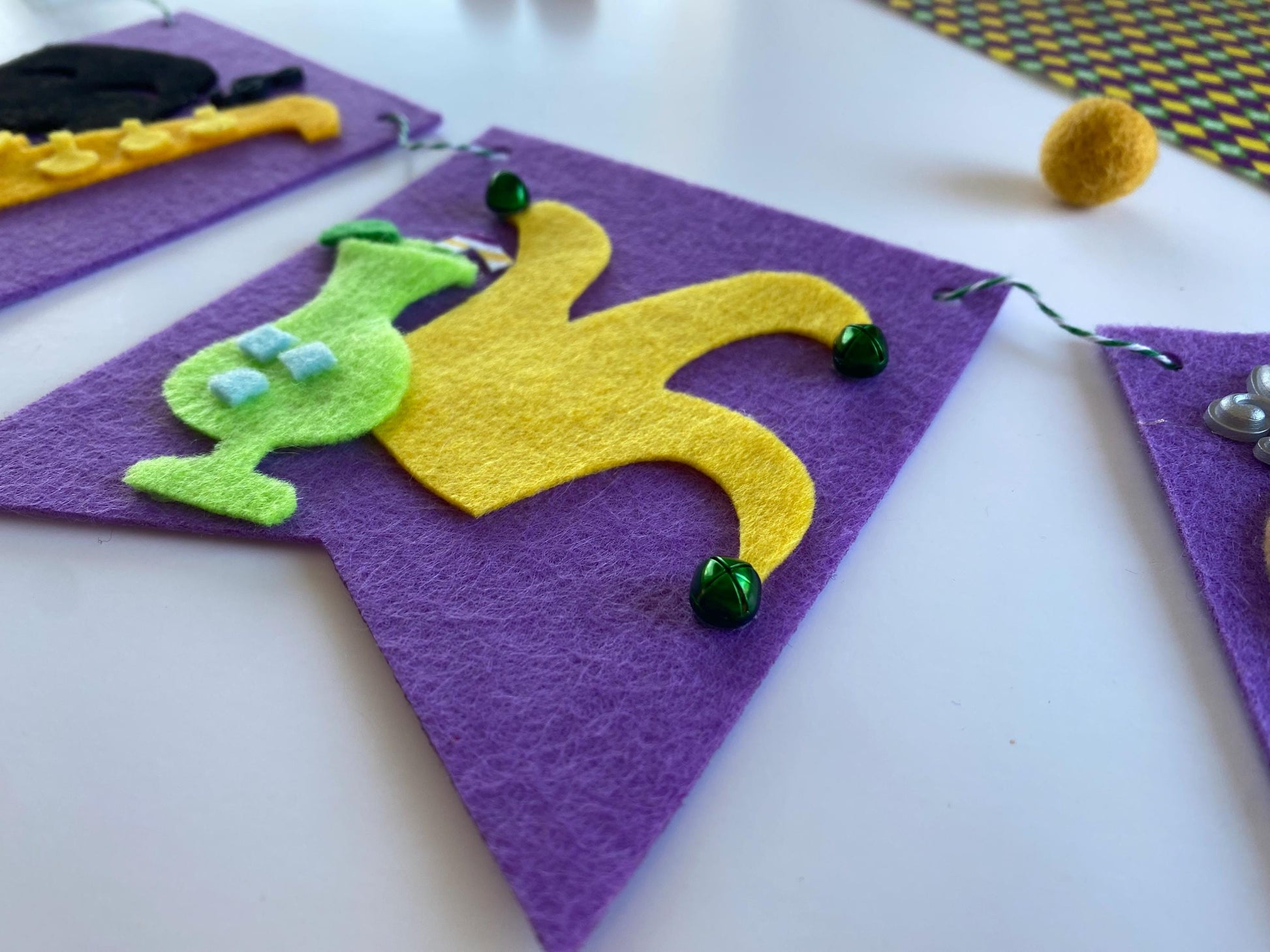 Mardi Gras Flag Bunting with Pennants featuring Bourbon St, King Cake, Masks, Fleur de Lis, Drinks, Beads, and Saxophone