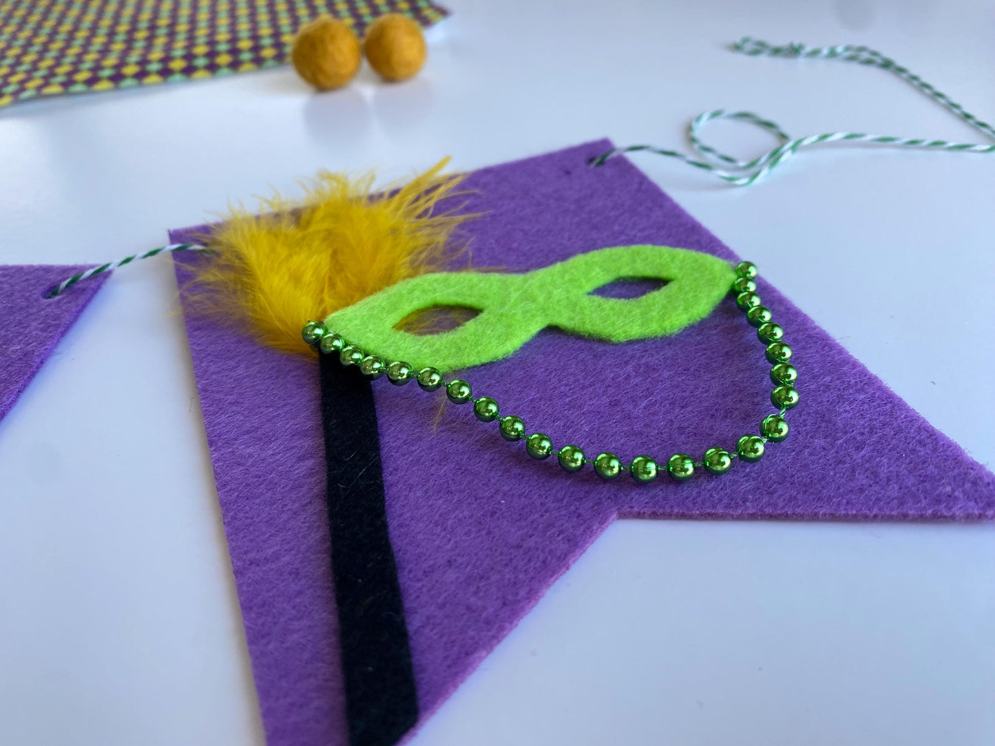 Mardi Gras Flag Bunting with Pennants featuring Bourbon St, King Cake, Masks, Fleur de Lis, Drinks, Beads, and Saxophone