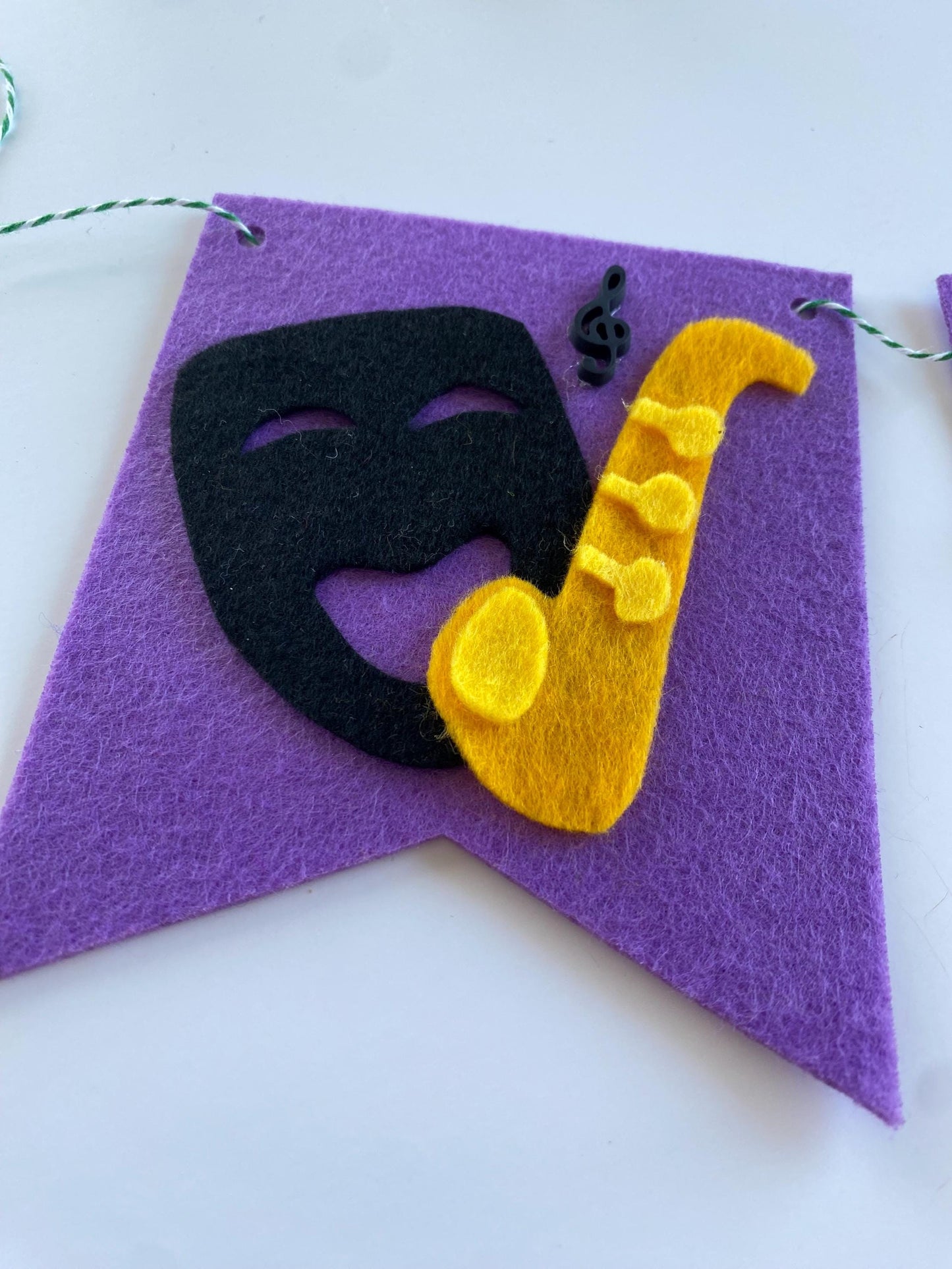 Mardi Gras Flag Bunting with Pennants featuring Bourbon St, King Cake, Masks, Fleur de Lis, Drinks, Beads, and Saxophone
