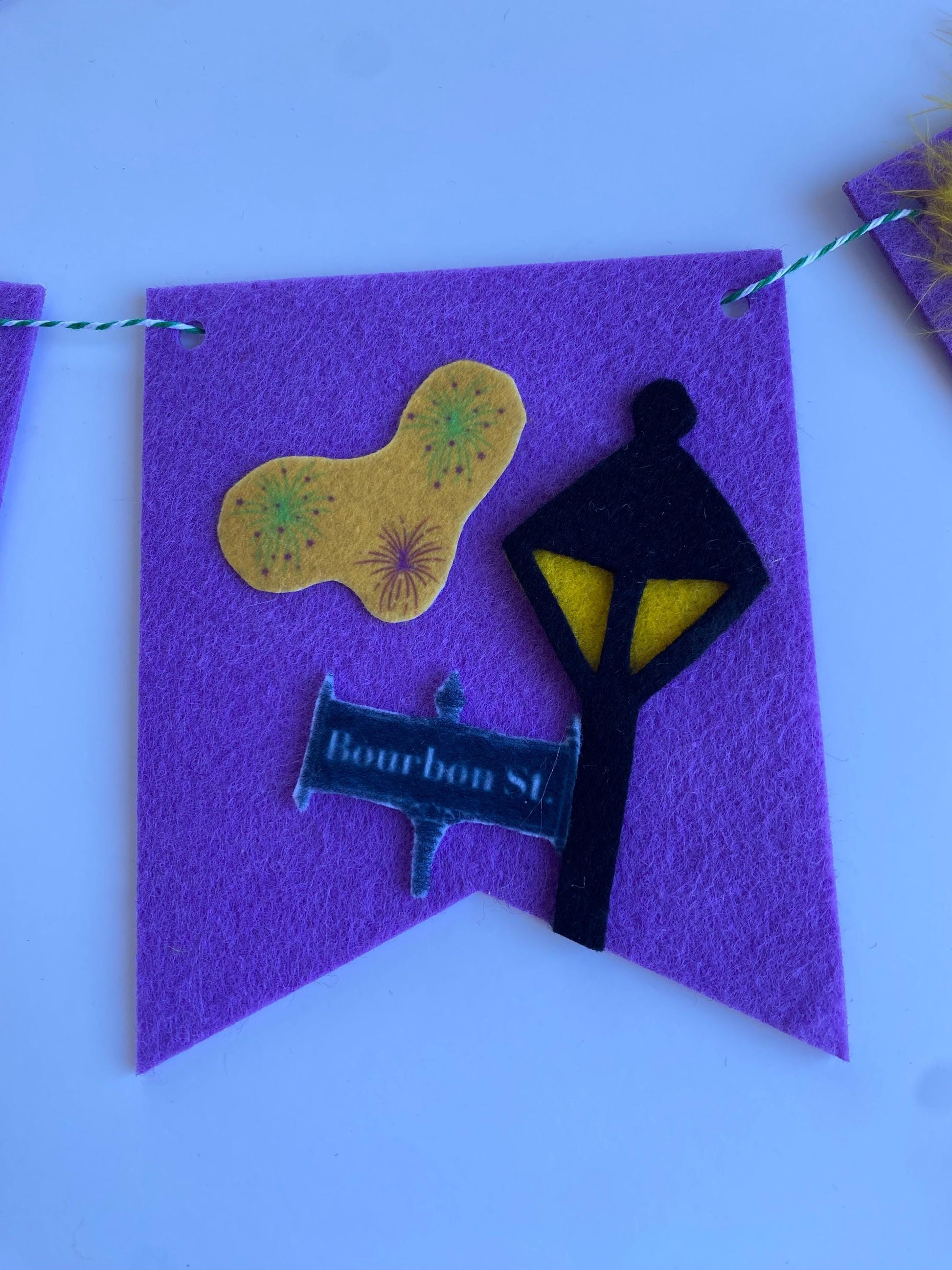 Mardi Gras Flag Bunting with Pennants featuring Bourbon St, King Cake, Masks, Fleur de Lis, Drinks, Beads, and Saxophone